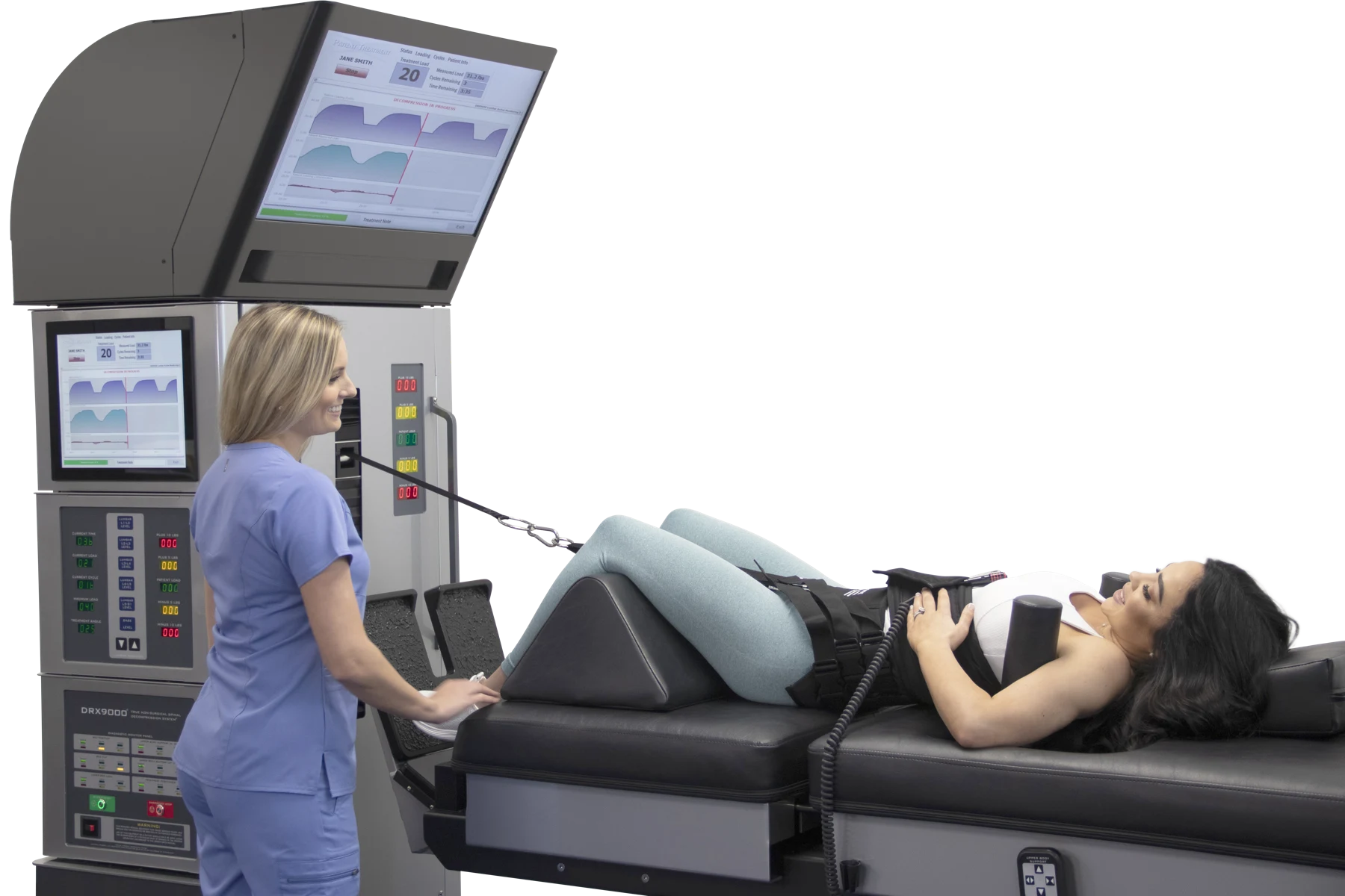 Clinician beside a patient on a DRX9000 decompression table
