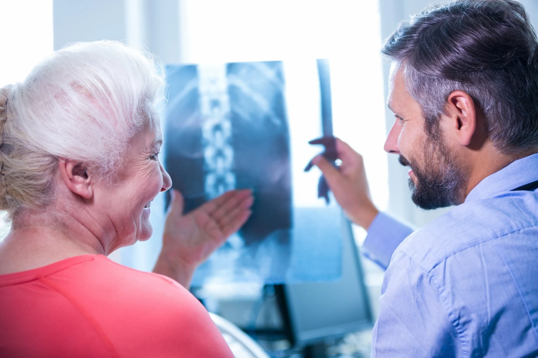 Clinician reviewing a spinal image with a patient